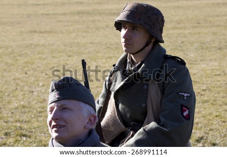 POZNAN, POLAND - MARCH 23, 2014: Re-enactment of the battle of the World War II. Anniversary of the liberation of the city of Poznan.
