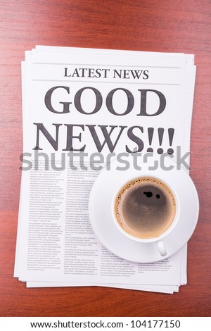 The newspaper LATEST NEWS with the headline GOOD NEWS  and coffee