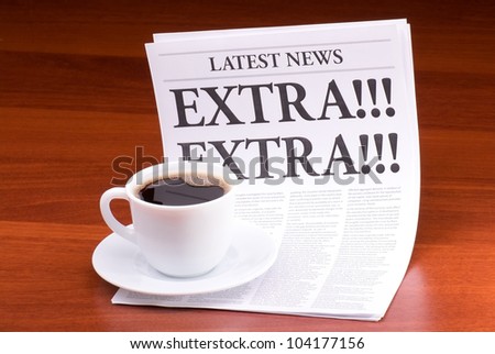 The newspaper LATEST NEWS with the headline EXTRA! EXTRA! on table