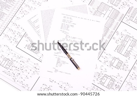 Pen on paper with the program and drawing of electrical circuits
