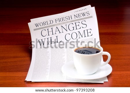 Newspaper CHANGES WILL COME and cup of coffee