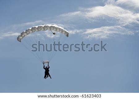 Silhouette of a parachute tandem jump