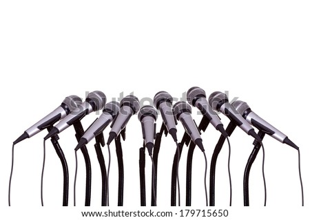 press conference with microphones on white background