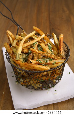 Fresh home cut french fries with fresh parsley and parmesan cheese