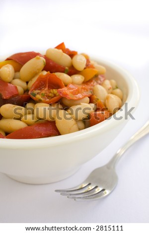 Health White Bean Salad with roasted red peppers and roasted tomatos. Navy Bean Salad with roasted Tomato and roasted re peppers. I heatlhy start to lunch. Space for your copy or text.