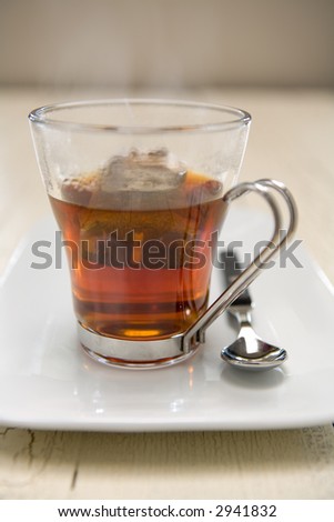 Brewing tea with a tea bag in hot water