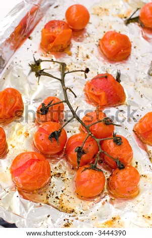 Roasted Cherry Tomatoes on the vine with olive oil, sea salt and black pepper. A delicious start to any meal.