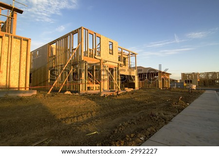 New construction, framing, houses with sky, dirt front