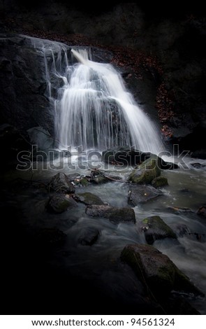 Mysterious Waterfall with dark background.