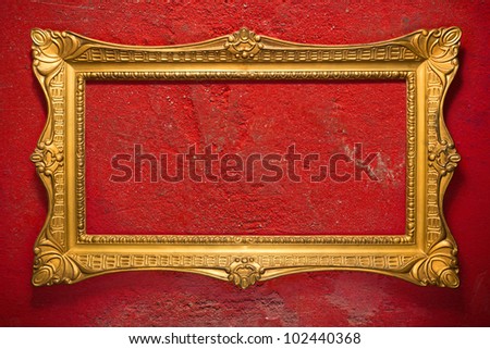 Horizontal golden frame on red, grunge garage wall, inner and outer clipping paths included