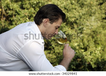 man smelling wine