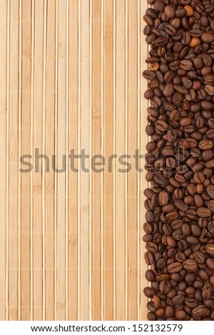 Coffee beans lying on a bamboo mat, background, menu