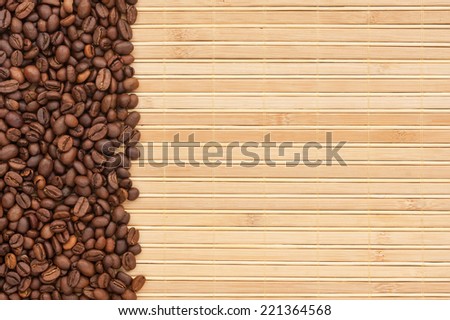 Coffee beans lying on a bamboo mat, background, menu
