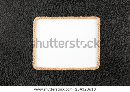 Frame of rope, lies on a background of a black natural leather, with place for your text