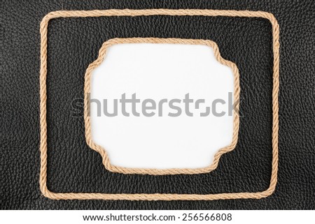 Two frame of rope, lies on a background of a black natural leather, with place for your text