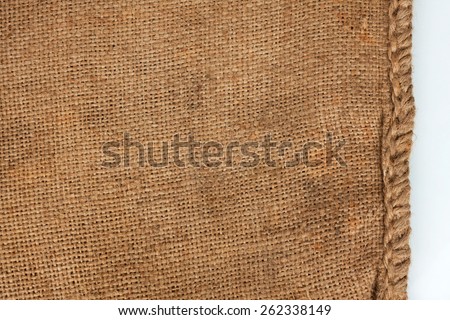 Rough seam on an old burlap, white background