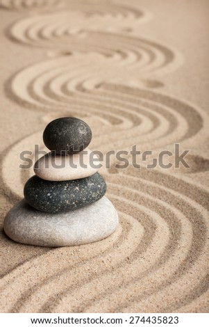 Pyramid  made of  stones standing on the sand, as background