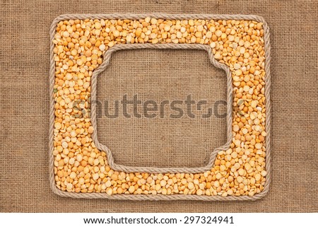 Two frames made of rope with dried peas grains on sackcloth, as background, texture