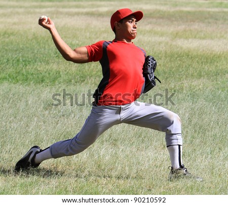 Baseball player throws a ball with strength