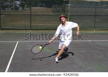 A blonde male tennis player takes a step into a solid forehand return swing
