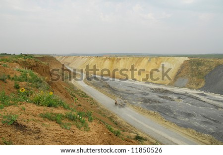 Open-pit mining for lignite (brown coal) that is burnt and transformed to electricity by the power station