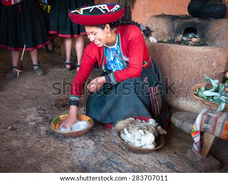 CUSCO, PERU - MAY 2015 : An unidentified woman washes alpaca wool at Textiles Puka on May 2nd,  2015 in Cusco, Peru.