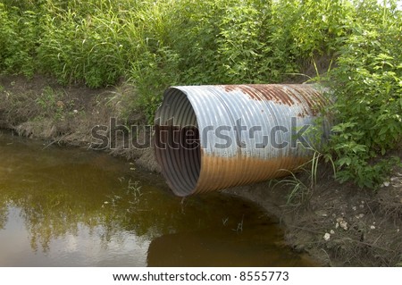 Waste water drain pipe over dirty water