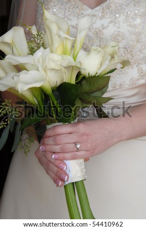 Bride holding live bouquet of flowers