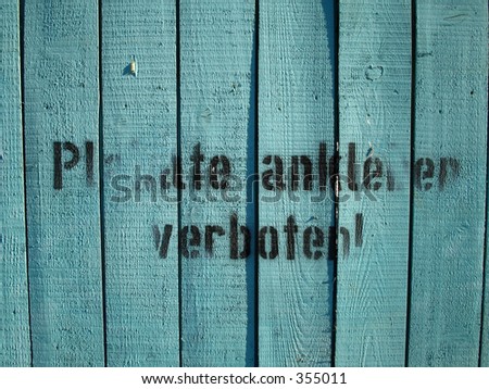 building site fence. stock photo : green fence around a uilding site with the german text amp;quot;Plakate