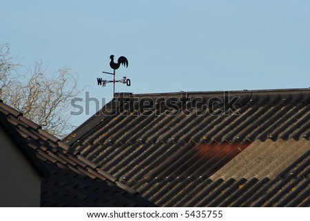 Dutch Weather Vane Atop The Roof of a Barn in the Rural Netherlands.