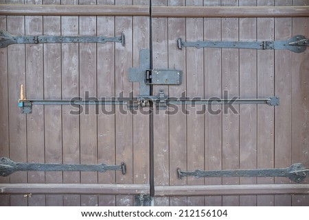 Big wooden gate with iron latches