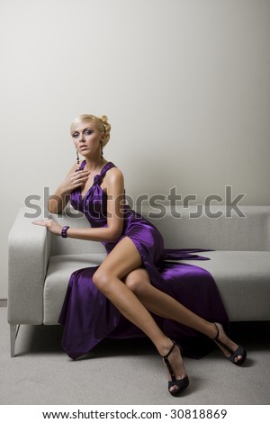 blond woman in violet dress
