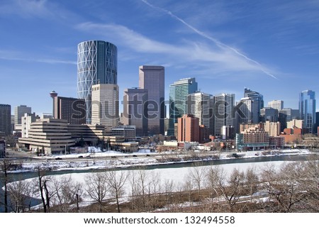Skyline of Calgary, Alberta, Canada  Bow River partly covered with Snow and Ice. Picture taken March 8, 2013