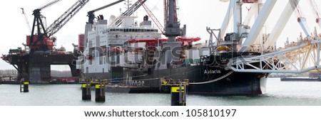 ROTTERDAM, THE NETHERLANDS - 14 APRIL : The \'Audacia\'; a 225m deep-sea pipe-laying vessel and the \'Balder\' (back) one of the largest deepwater construction vessels in Rotterdam on April 14, 2012