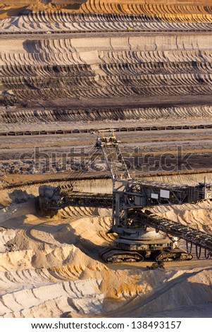 A large bucket wheel excavator digging brown-coal in an open-pit mine