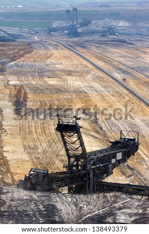 A large bucket wheel excavator digging brown-coal in an open-pit mine