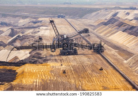 A conveyor belt and a very large backloader in a lignite (browncoal) mine