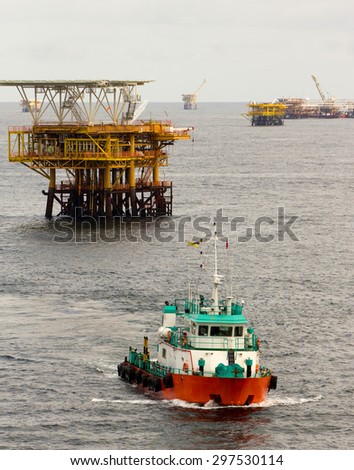 Oil rigs and a transportation vessel in the South China Sea