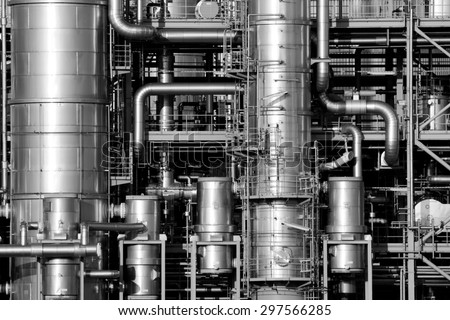 Close-up of pipelines and destillation tanks of an oil-refinery plant