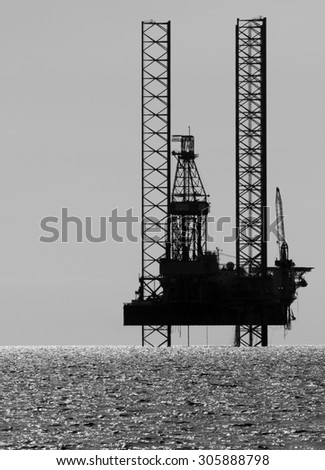 Silhouette of an offshore drilling rig, South China Sea, Malaysia
