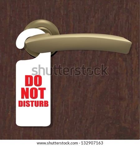 Do Not Disturb Sign With Door Handle And Wooden Background