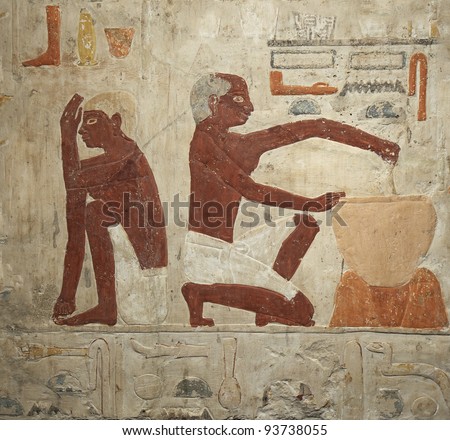 A wall painting of an ancient egyptian making batter for bread manufacturing. 5th Dynasty (2500-2350 BC)