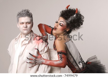 Angel and devil on a grey background