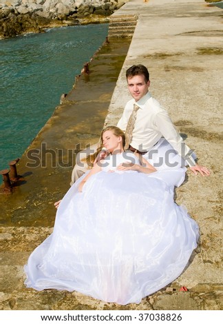 Portrait of the groom and bride on a background mooring