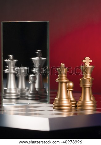 Chess figure and mirror on a black background