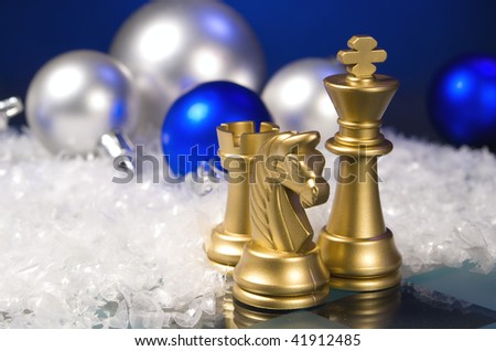 Christmas chess and snow on a dark background
