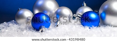 New Year's spheres and snow on a dark background