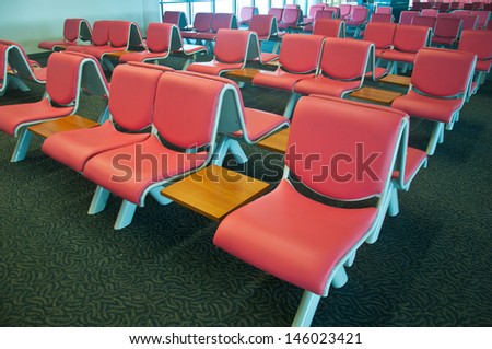 rushed passengers in the airport waiting room.