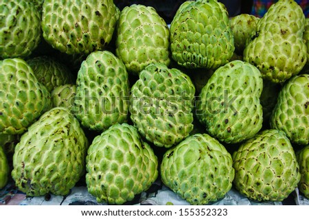 Fresh organic white bulb Custard Apple for sale at a market for farm products