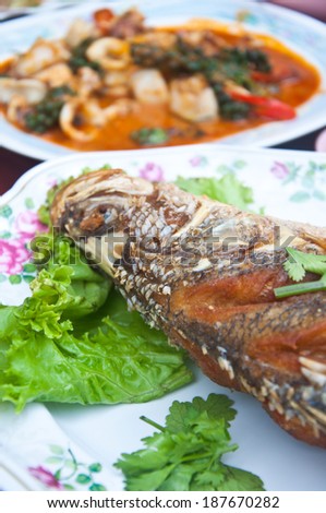 Fish fried on plate thai food - Table dinner